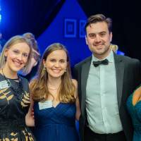 Guests smiling together after Enrichment